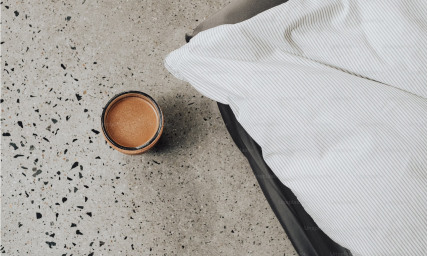 An overhead image of coffee beverage on a counter