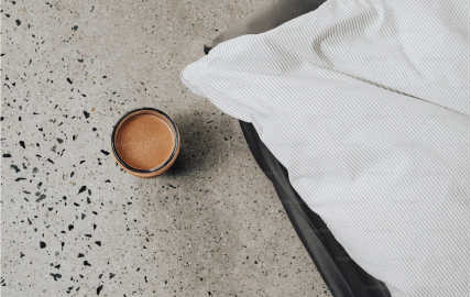 An overhead image of coffee beverage on a counter